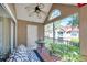 Enclosed lanai showcasing tiled floor, outdoor furniture and community view at 9481 Highland Oak Dr # 806, Tampa, FL 33647