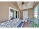 Enclosed lanai features a ceiling fan, tiled floors, and sliding glass doors leading to the inside at 9481 Highland Oak Dr # 806, Tampa, FL 33647