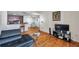 Living room showcasing wood floors and open kitchen and dining area at 9481 Highland Oak Dr # 806, Tampa, FL 33647