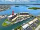 Luxury waterfront condo building in a coastal community with boat docks, swimming pool and tennis courts at 1 Key Capri # 606W, Treasure Island, FL 33706