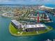 Luxury waterfront condo building in a coastal community with boat docks, swimming pool and tennis courts at 1 Key Capri # 606W, Treasure Island, FL 33706