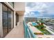 High floor balcony with a beautiful view of the pool and waterfront at 1 Key Capri # 606W, Treasure Island, FL 33706