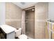 Bathroom features a tiled shower with updated fixtures and a modern design at 1 Key Capri # 606W, Treasure Island, FL 33706