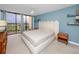 Cozy bedroom with a private balcony and views of the surrounding landscape at 1 Key Capri # 606W, Treasure Island, FL 33706