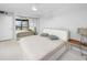 Bright bedroom featuring a comfortable bed, ample closet space, and scenic views at 1 Key Capri # 606W, Treasure Island, FL 33706