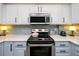 Updated kitchen features stainless steel appliances and a stylish tile backsplash at 1 Key Capri # 606W, Treasure Island, FL 33706