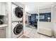 Convenient in-unit laundry area with stackable washer and dryer near the living space at 1 Key Capri # 606W, Treasure Island, FL 33706