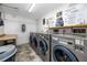 Clean community laundry room equipped with modern washers and dryers at 1 Key Capri # 606W, Treasure Island, FL 33706