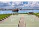 Community shuffleboard court with benches offering views of the surrounding waterfront at 1 Key Capri # 606W, Treasure Island, FL 33706