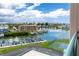 Breathtaking water view from the balcony showcasing boat docks and lush greenery at 1 Key Capri # 606W, Treasure Island, FL 33706