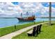 Scenic waterfront view featuring a decorative boat with outdoor seating at 1 Key Capri # 606W, Treasure Island, FL 33706