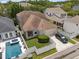An inviting home featuring a fenced backyard, a refreshing pool, and a private, covered patio at 10021 Brompton Dr, Tampa, FL 33626