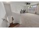 Expansive bonus room with plush carpeting and bright windows, ideal for relaxation or recreation at 10021 Brompton Dr, Tampa, FL 33626