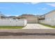 Charming home featuring a two-car garage, long driveway, and white picket fence at 10021 Brompton Dr, Tampa, FL 33626