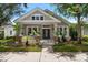 Charming home featuring manicured landscaping, neutral paint, and a welcoming covered porch entry at 10021 Brompton Dr, Tampa, FL 33626