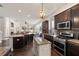 Spacious kitchen featuring stainless steel appliances, dark wood cabinetry, and granite countertops at 10021 Brompton Dr, Tampa, FL 33626