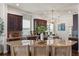 Updated kitchen with stainless appliances, granite counters, dark cabinets, and island seating at 10021 Brompton Dr, Tampa, FL 33626