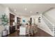 Bright kitchen featuring dark wood cabinets, stainless steel appliances, an island, and wooden floors at 10021 Brompton Dr, Tampa, FL 33626