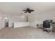 Spacious loft area with neutral carpet, bright white walls, and a convenient desk at 10021 Brompton Dr, Tampa, FL 33626