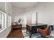 Home office with a dark wood desk, herringbone floors, and window views at 10021 Brompton Dr, Tampa, FL 33626