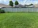 Spacious backyard with lush green grass and a privacy fence for outdoor enjoyment at 10108 Rosemary Leaf Ln, Riverview, FL 33578