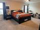 Cozy main bedroom featuring a comfortable bed and natural light, plus neutral tones at 10108 Rosemary Leaf Ln, Riverview, FL 33578