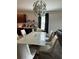 Bright dining area with modern lighting and seating, perfect for Gathering meals at 10108 Rosemary Leaf Ln, Riverview, FL 33578