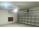Spacious garage with a metal door, ready for parking and storage at 10108 Rosemary Leaf Ln, Riverview, FL 33578
