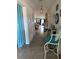 Inviting hallway with tiled floors and stylish decor leading to the living area at 10108 Rosemary Leaf Ln, Riverview, FL 33578