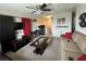 Relaxing living room with ceiling fan and movie-themed decorations, perfect for entertainment at 10108 Rosemary Leaf Ln, Riverview, FL 33578