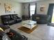 Comfortable living room with plush seating, bright light, and modern decor at 10108 Rosemary Leaf Ln, Riverview, FL 33578