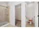 Bathroom features a walk-in shower, toilet and open shelving in the closet at 11144 Paradise Point Way, New Port Richey, FL 34654