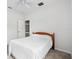 Cozy bedroom featuring a ceiling fan, neutral walls, and plush carpeting at 11144 Paradise Point Way, New Port Richey, FL 34654