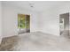 Bright bedroom features a ceiling fan and sliding doors to the screened porch at 11144 Paradise Point Way, New Port Richey, FL 34654
