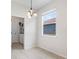 Cozy dining room next to laundry room, with tiled floor and natural light at 11144 Paradise Point Way, New Port Richey, FL 34654