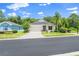 Charming single-story home featuring a well-manicured lawn and a two-car garage, perfect for suburban living at 11144 Paradise Point Way, New Port Richey, FL 34654