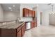 Kitchen with granite countertops, stainless dishwasher, and stylish cabinetry at 11144 Paradise Point Way, New Port Richey, FL 34654