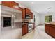 Updated kitchen with stainless steel appliances and granite countertops, perfect for cooking at 11144 Paradise Point Way, New Port Richey, FL 34654