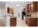 Modern kitchen with stainless appliances, granite counters, and ample cabinet space at 11144 Paradise Point Way, New Port Richey, FL 34654