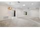 Expansive living room with carpet flooring, recessed lighting, and open access to other areas at 11144 Paradise Point Way, New Port Richey, FL 34654