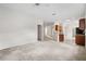 Large living area provides seamless flow to the kitchen, enhancing the home's open design at 11144 Paradise Point Way, New Port Richey, FL 34654