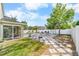 Spacious backyard featuring a large patio area with pavers, perfect for entertaining and outdoor activities at 11539 Tangle Branch Ln, Gibsonton, FL 33534
