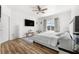 Comfortable bedroom with a ceiling fan and a window view at 11539 Tangle Branch Ln, Gibsonton, FL 33534