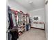Walk-in closet with shelving and drawer, providing ample storage at 11539 Tangle Branch Ln, Gibsonton, FL 33534