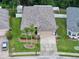 Well-maintained single-Gathering home with lush lawn, landscaping, and neutral exterior paint at 12200 Hunters Lake Dr, New Port Richey, FL 34654