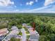 Aerial view of a wooded neighborhood with tree-lined streets at 12200 Hunters Lake Dr, New Port Richey, FL 34654