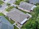 Home features a patio, mature trees, a lush lawn, and a neutral exterior paint at 12200 Hunters Lake Dr, New Port Richey, FL 34654