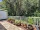 Backyard patio with brick flooring and decorative potted plants, offering a relaxing outdoor space at 12200 Hunters Lake Dr, New Port Richey, FL 34654