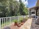 Landscaped backyard with a lush garden, a patio, brick flooring, and a serene setting at 12200 Hunters Lake Dr, New Port Richey, FL 34654