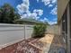 View of backyard patio with brick pavers, rocks and mulched areas, surrounded by privacy fencing at 12200 Hunters Lake Dr, New Port Richey, FL 34654